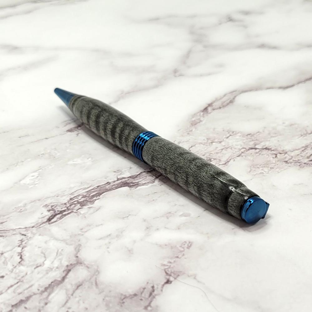 Black Curly Maple Everyday Twist Pen with a Blue Titanium Finish