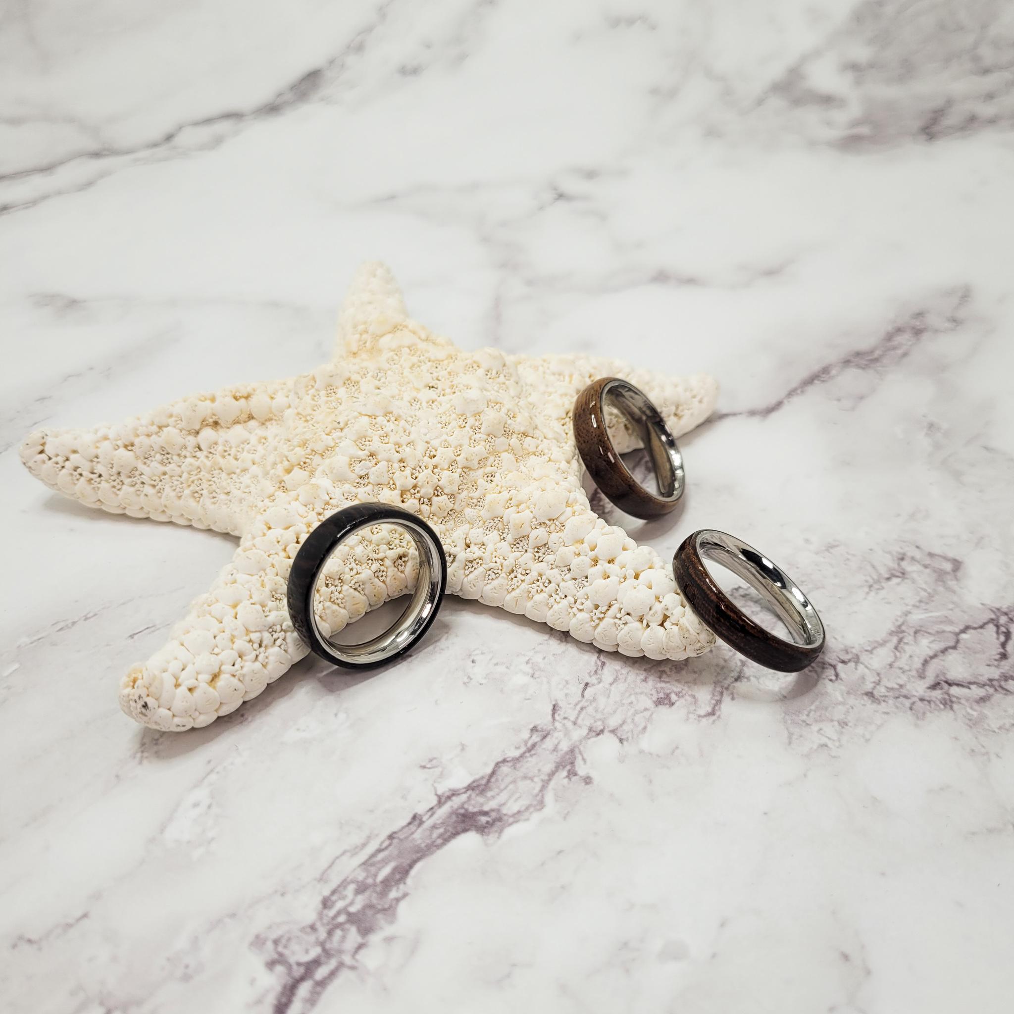 Exotic wood rings on display on a starfish