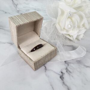 Walnut stainless steel ring in a ring box
