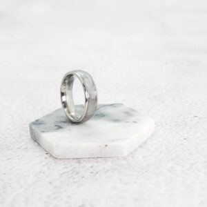 Selenite Stainless Steel Ring on a Marble coaster