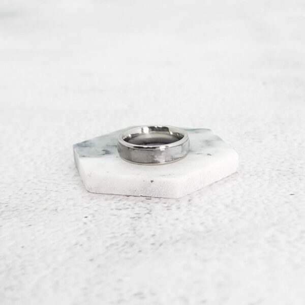Selenite Stainless Steel Ring on a Marble coaster